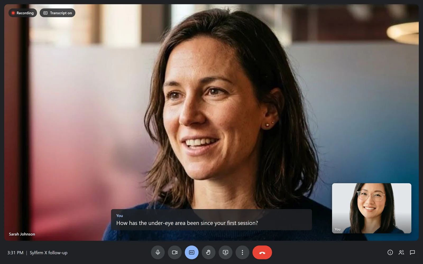 A telehealth visit in progress: the patient on video, the provider in the self-view tile, recording and transcript on, with live captions.